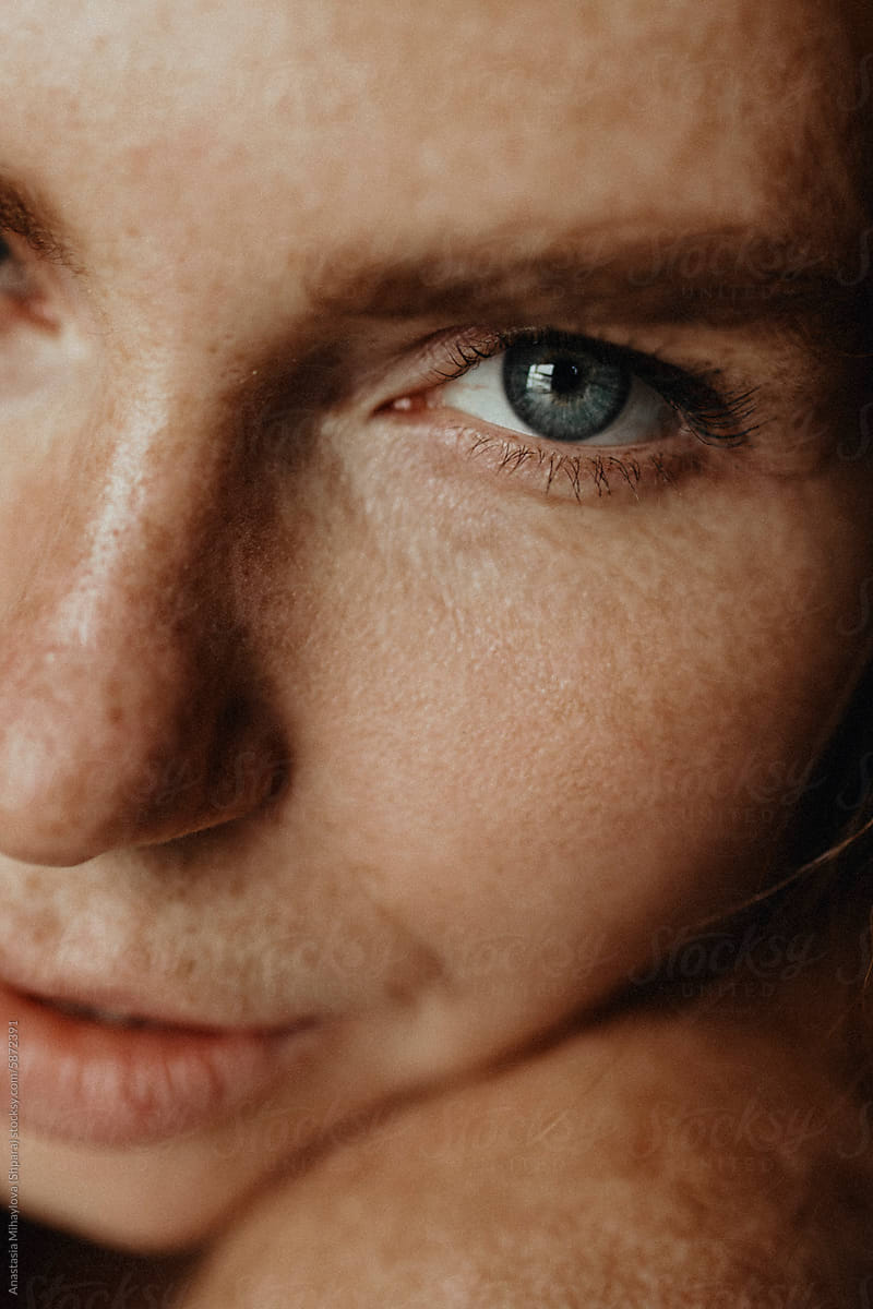 Close Up woman\'s portrait of Ginger female with many freckles on face