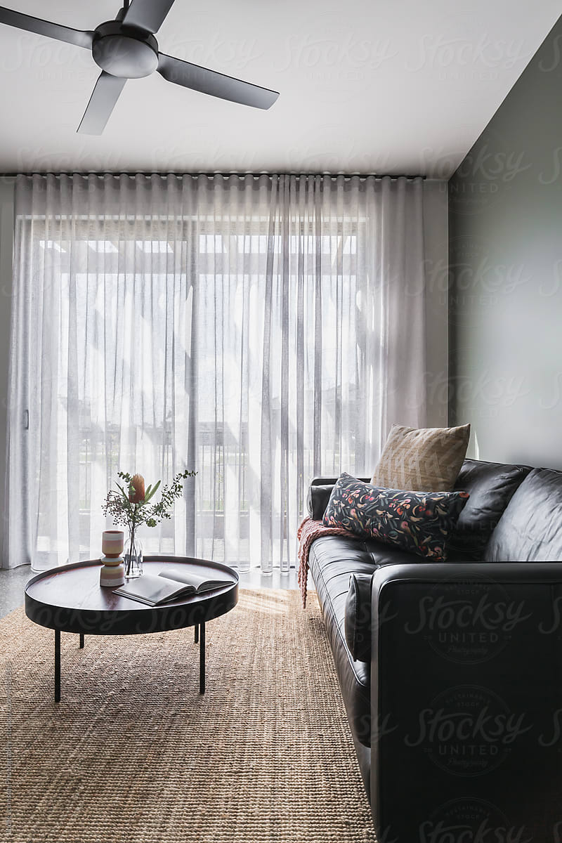 Cosy living room with sheer curtains