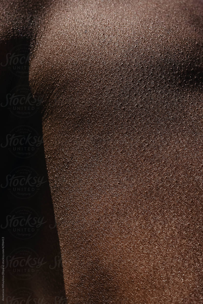 Close up black skin texture. Goose bumps on black skin