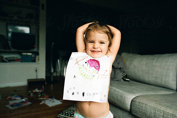 Little Girl Paints Inside by Stocksy Contributor Maria Manco