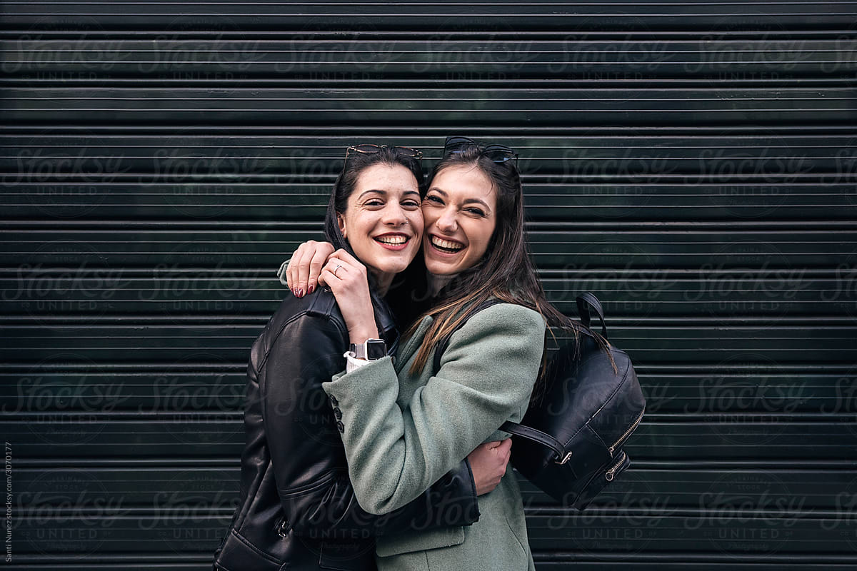 Lesbian Couple Laughing Together By Stocksy Contributor Santi Nuñez Stocksy