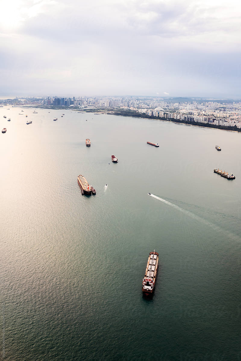 Aerial view of Singapore\'s east coastline and shipping freighters
