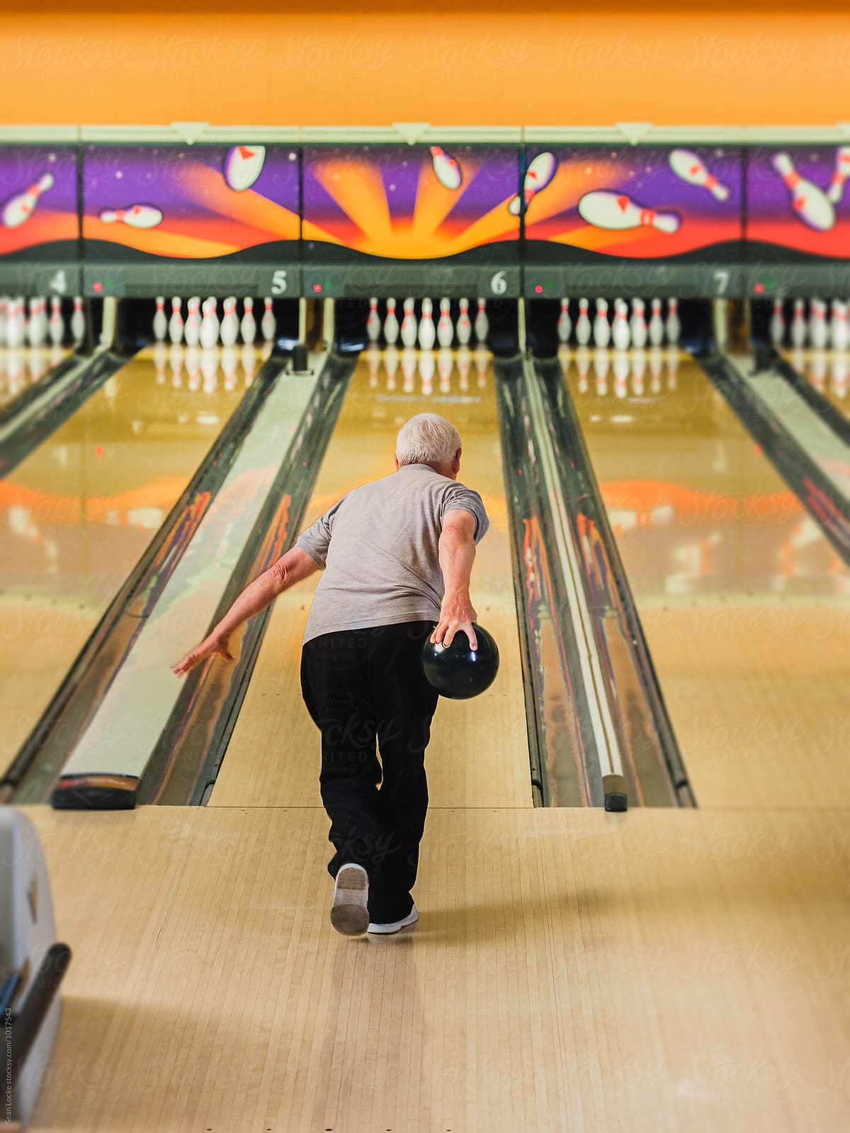 Bowling: Mature Male Bowler About To Bowl A Strike