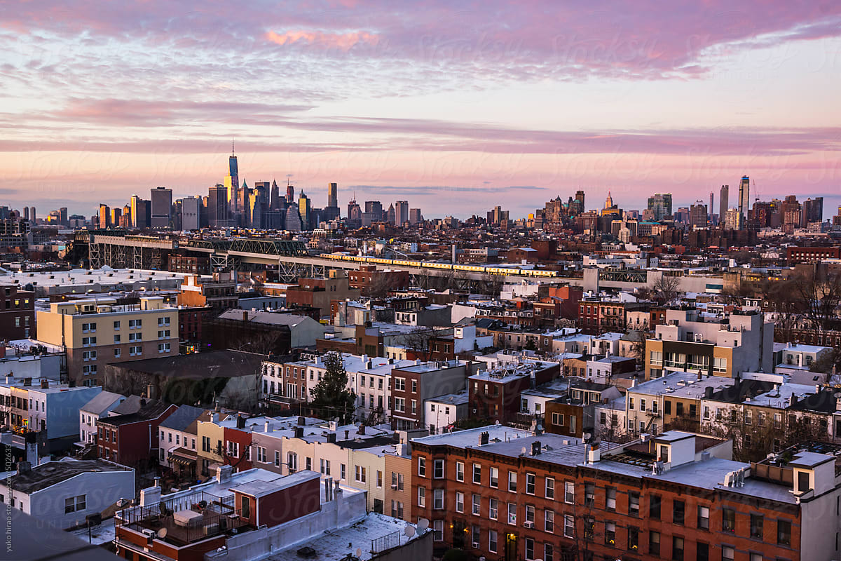 Lower Manhattan skyline over Brooklyn apartment rooftops