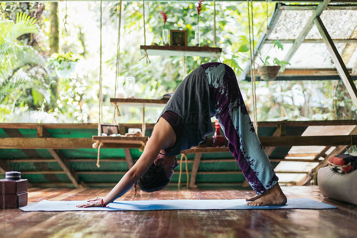 Woman Doing Yoga On A Wooden Porch