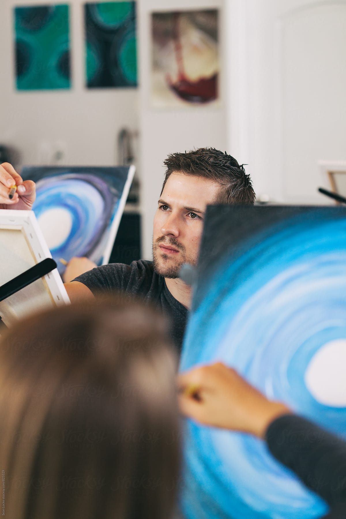 Painting: Man In Group Creating Art During Class