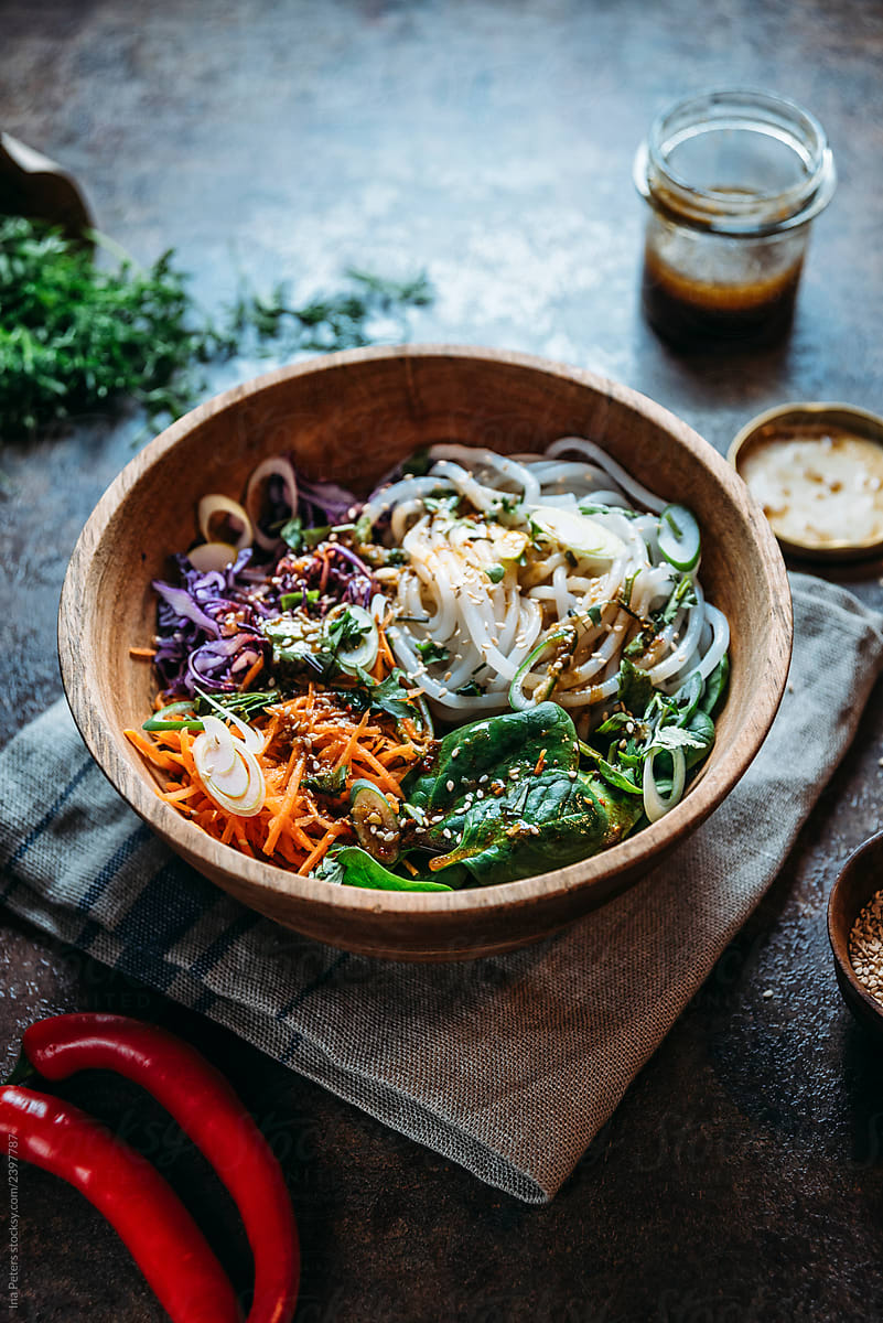 Food: Asian rice noodle bowl with raw vegetables