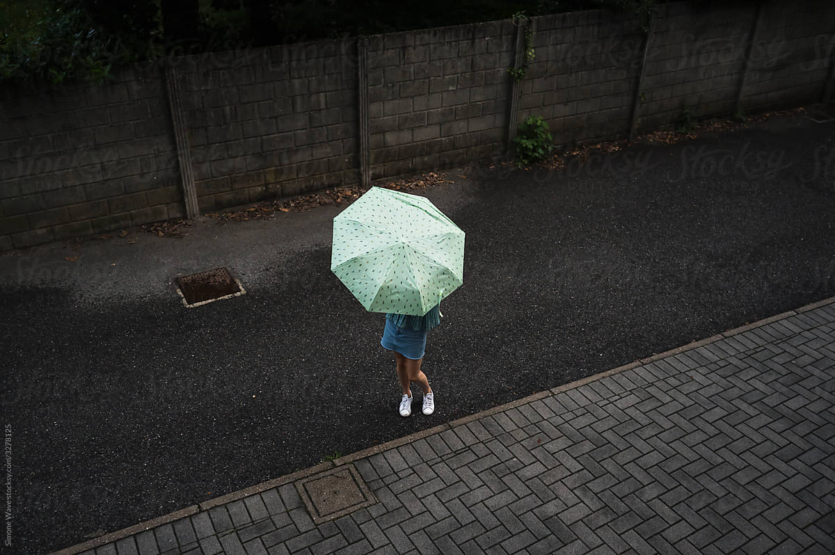 Woman with umbrella under the rain