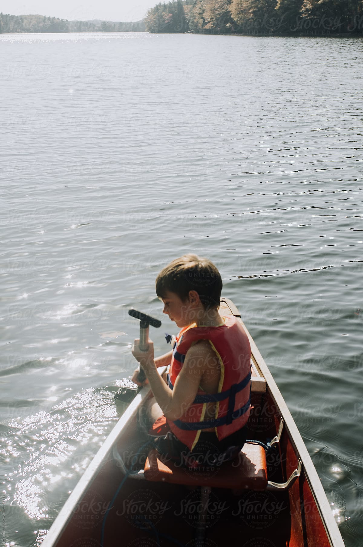 boy rowing in a canoe