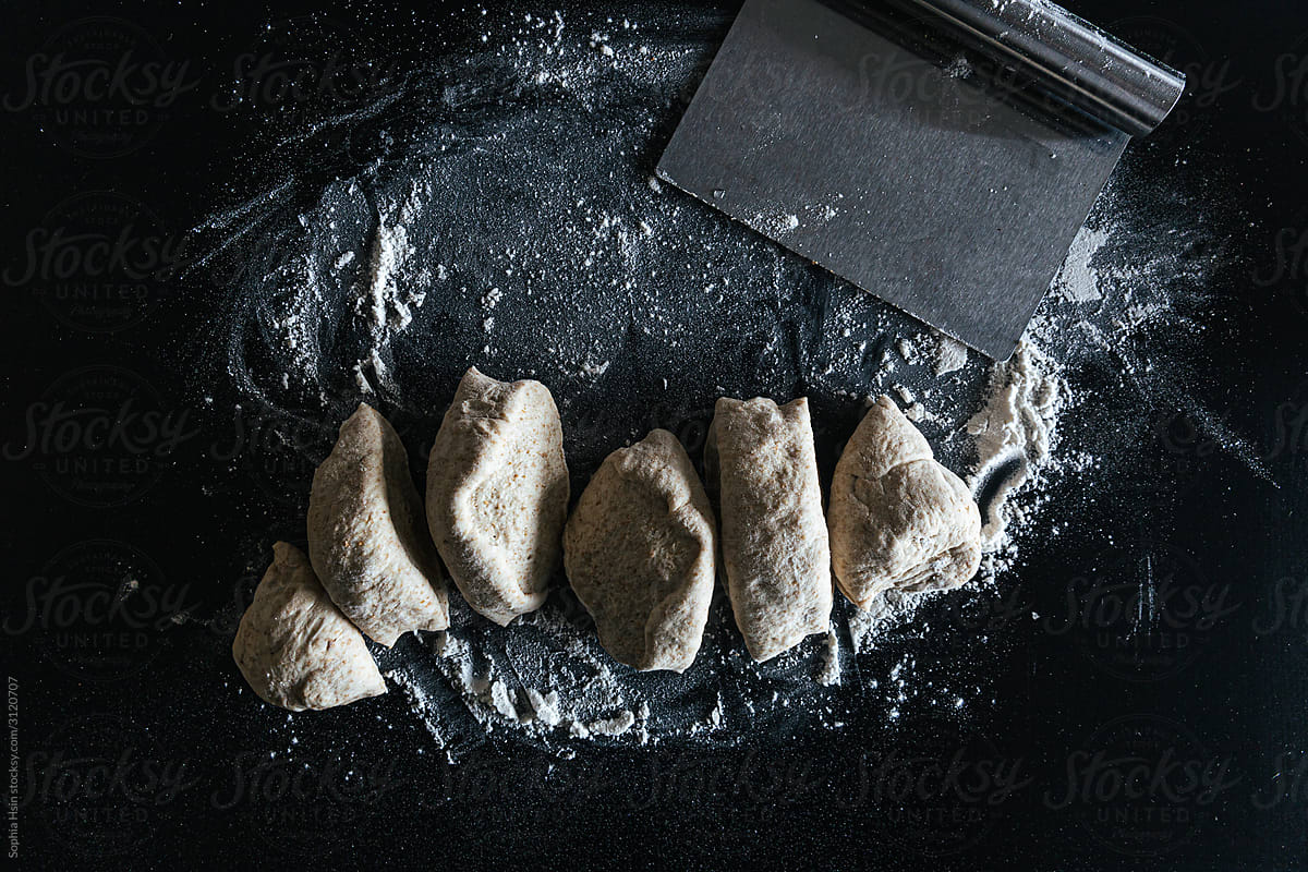 Dough scraper with mounds of fresh dough
