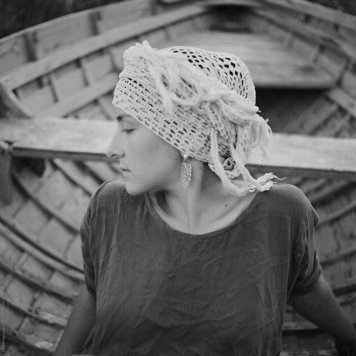 A Pensive Woman Seating In The Boat Del Colaborador De Stocksy Anna Malgina Stocksy