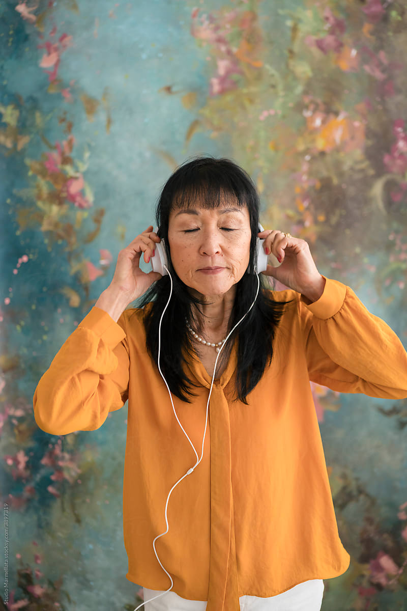 Serene woman listening to music in headphones