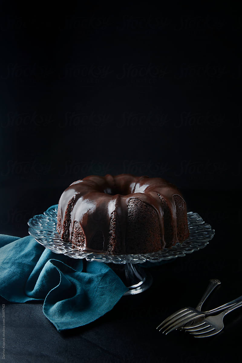 Chocolate Bundt Cake with Glaze on Cake Stand