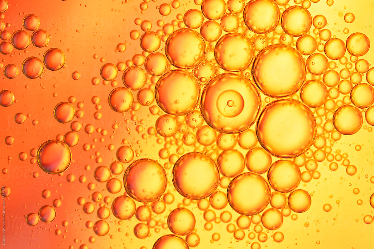 Red And Orange Oil Drops On Water Surface