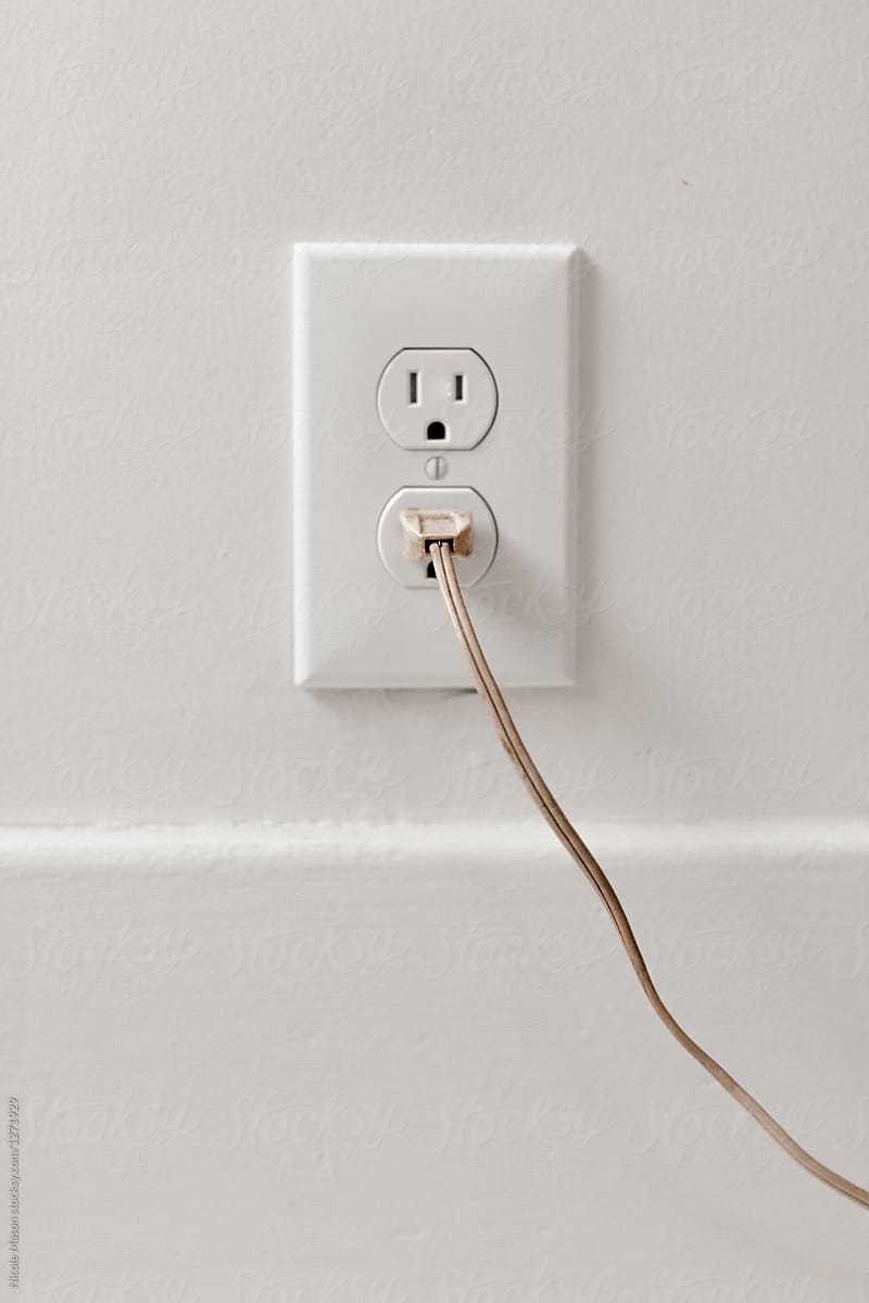 plug in white outlet on white wall