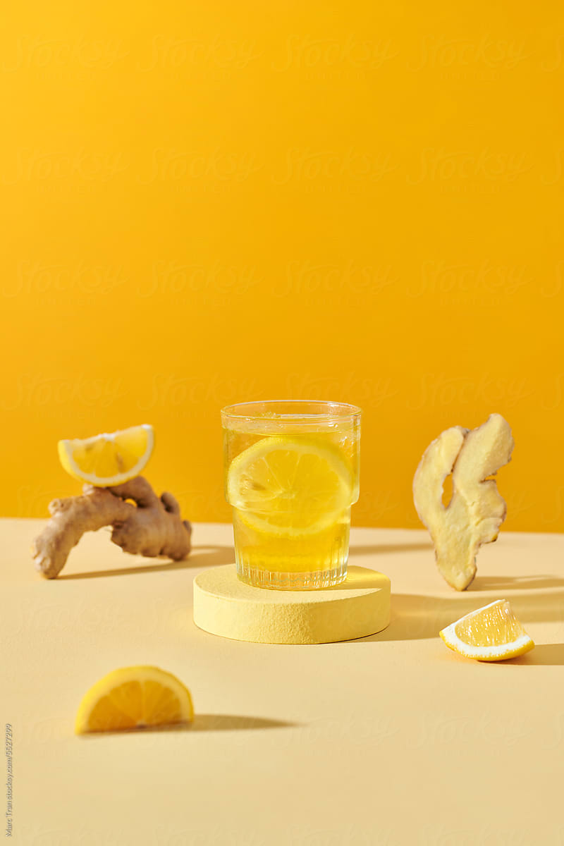 Homemade refreshing drink, iced lemon ginger tea in glasses.