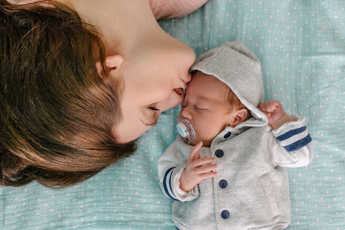 Mother Kissing A Newborn Baby Boy By Stocksy Contributor Aleksandra Jankovic Stocksy