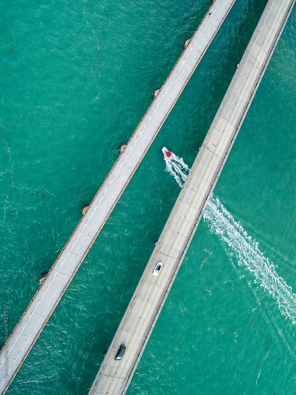 Boat traveling under the Seven Mile Bridge, Florida Keys, USA