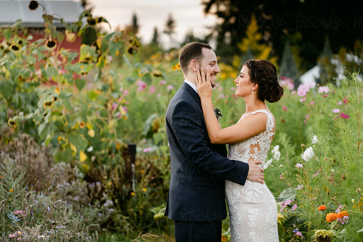 Beautiful Couple in Flower Garden on Wedding Day