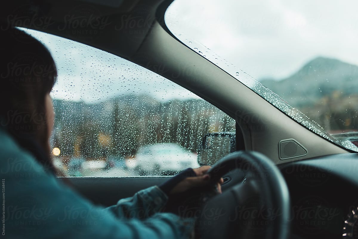 A woman driving in the rain