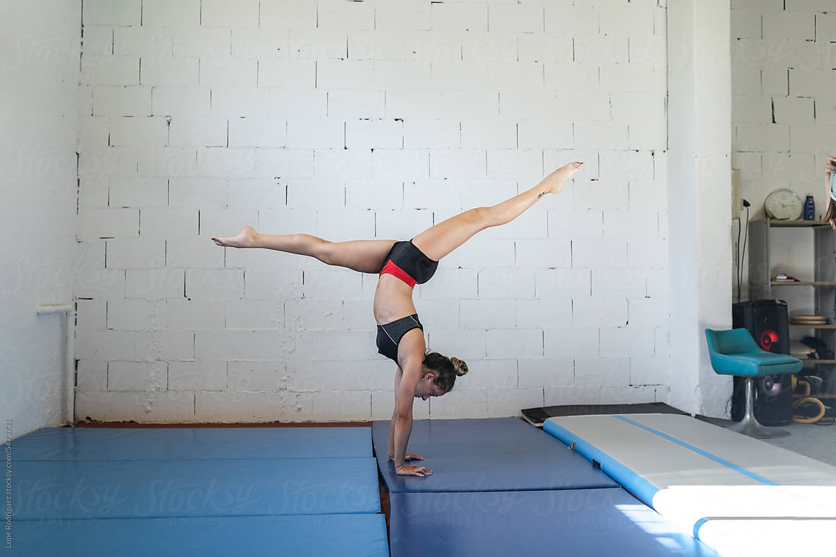 artistic gymnastics athlete training in a gym