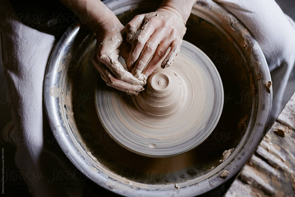 Ceramist throwing handmade pot