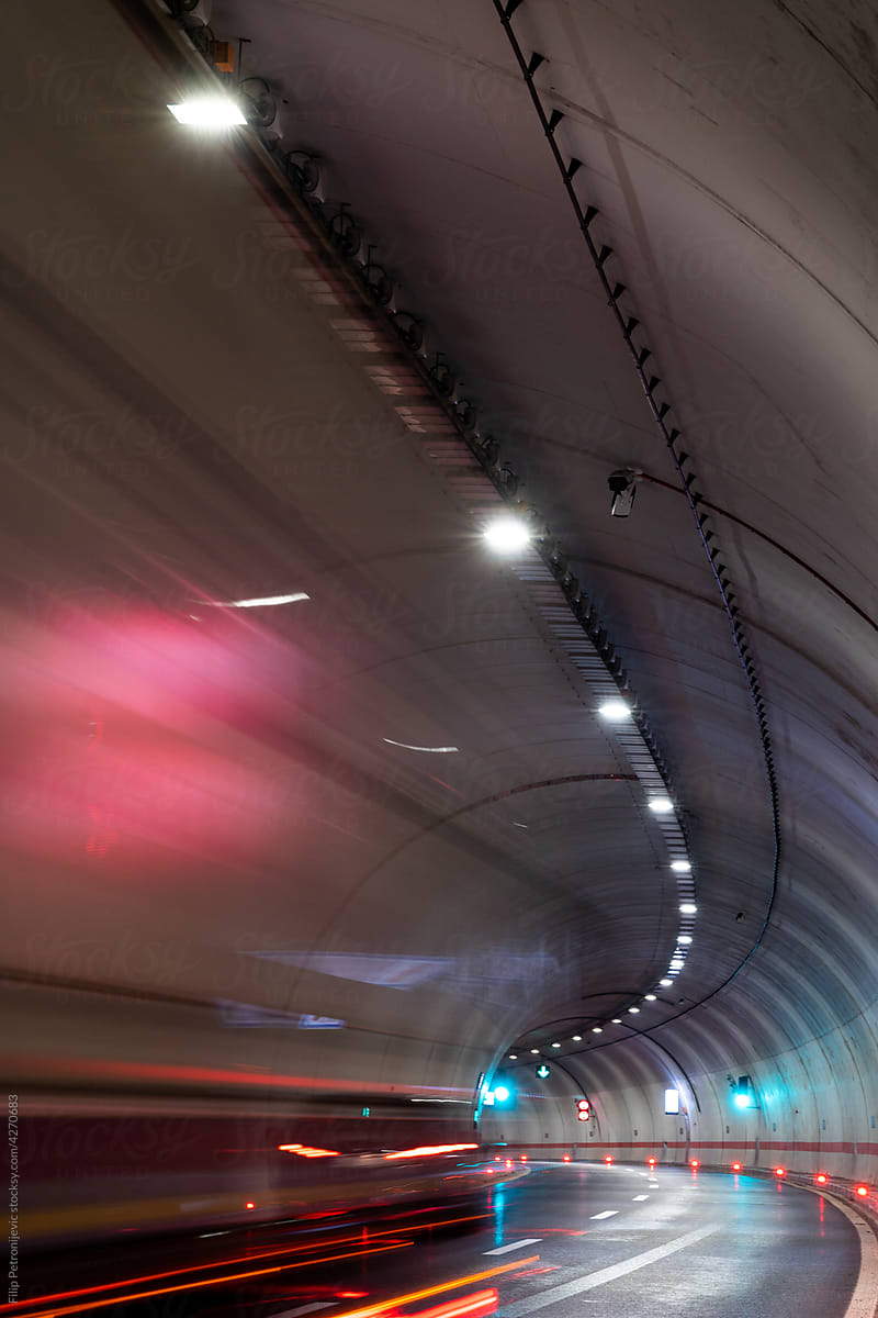 Motion blurred car in a tunnel